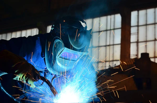 EMOH atelier — welder shaping a steel frame